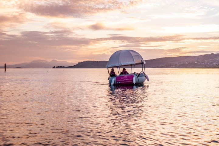 a small boat in a body of water