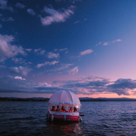 a small boat in a large body of water